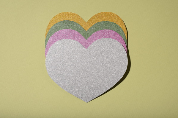 Multicolored Heart-Shaped Valentine Cards on Beige Background